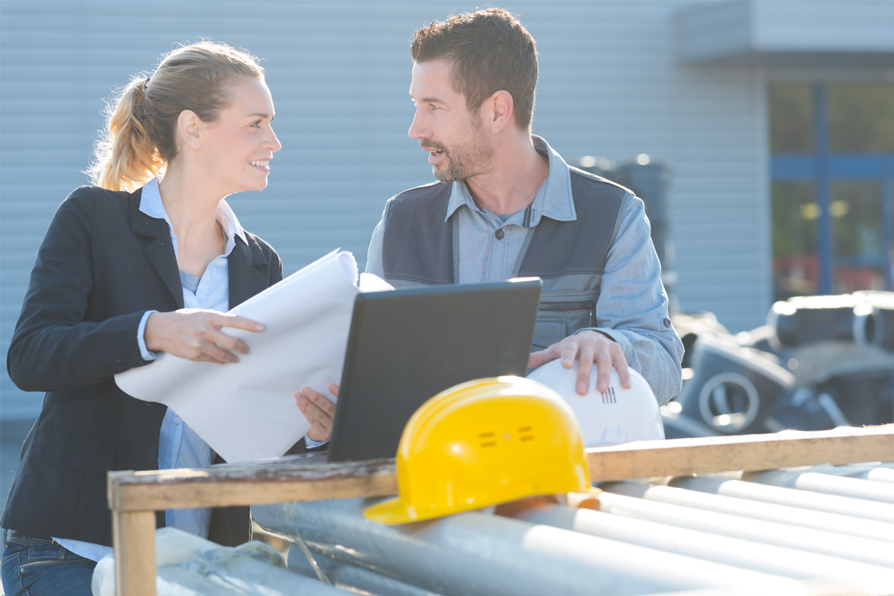 Workers ensuring every project is completed within the estimated budget and time frame.