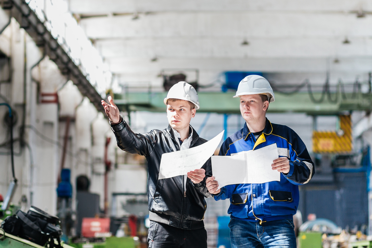 Engineering professionals discussing solutions for cost management.