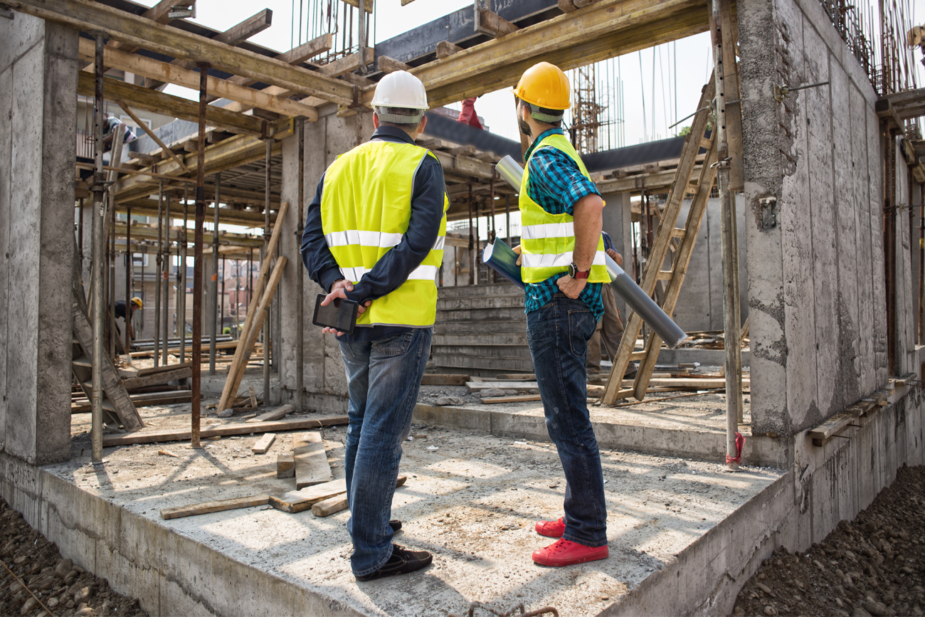Construction professionals analysing relationships between projects.