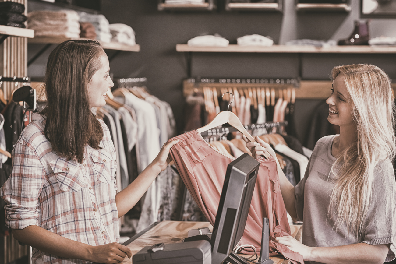 Retail fashion worker doing a point of sale entry.