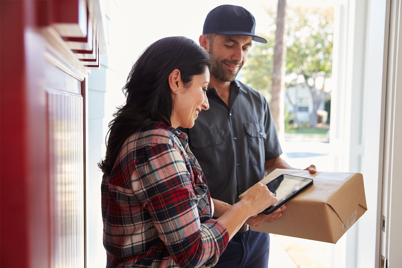 Courier delivering customers online order from warehouse.