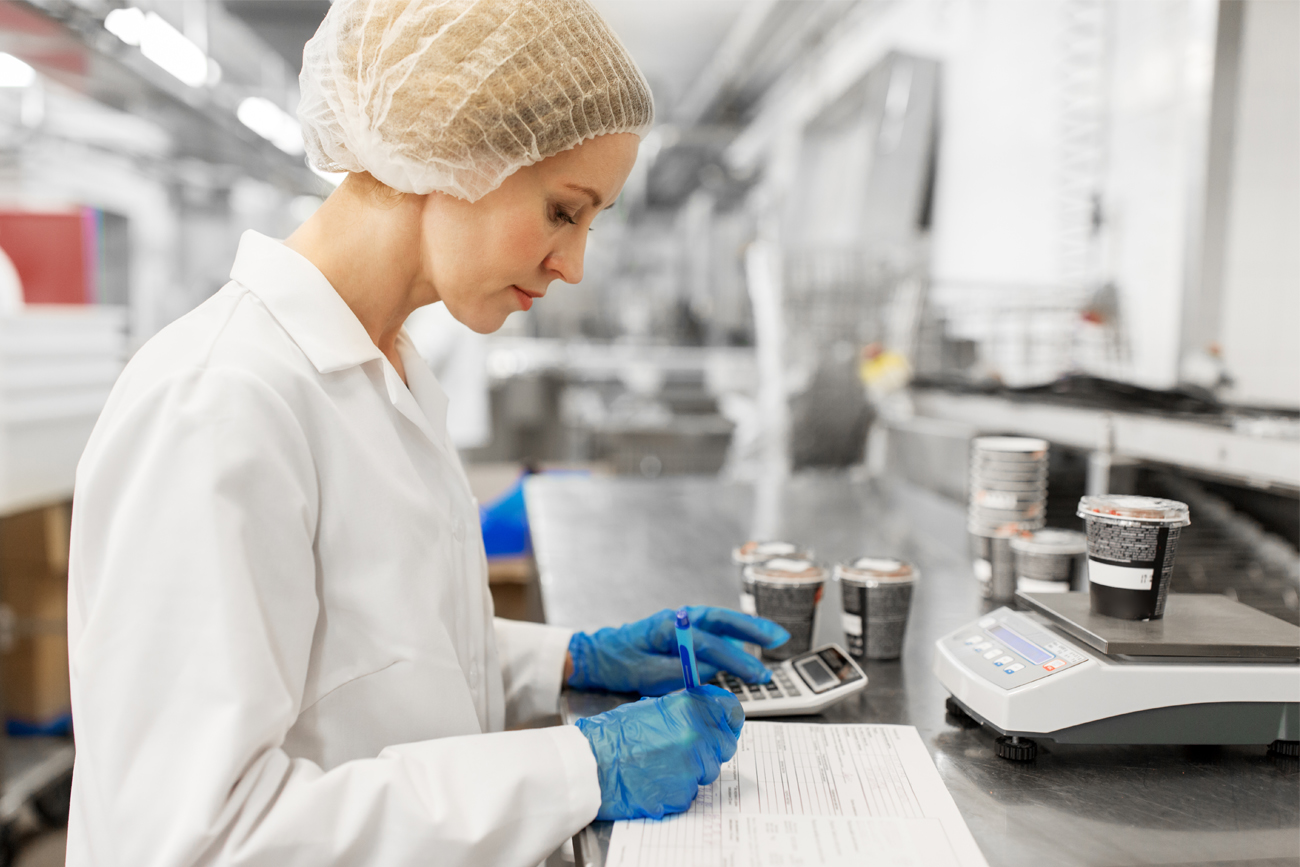 Food & beverage worker maintaining product data management