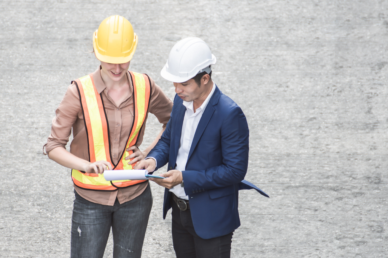 Civil engineers discussing project workflow.