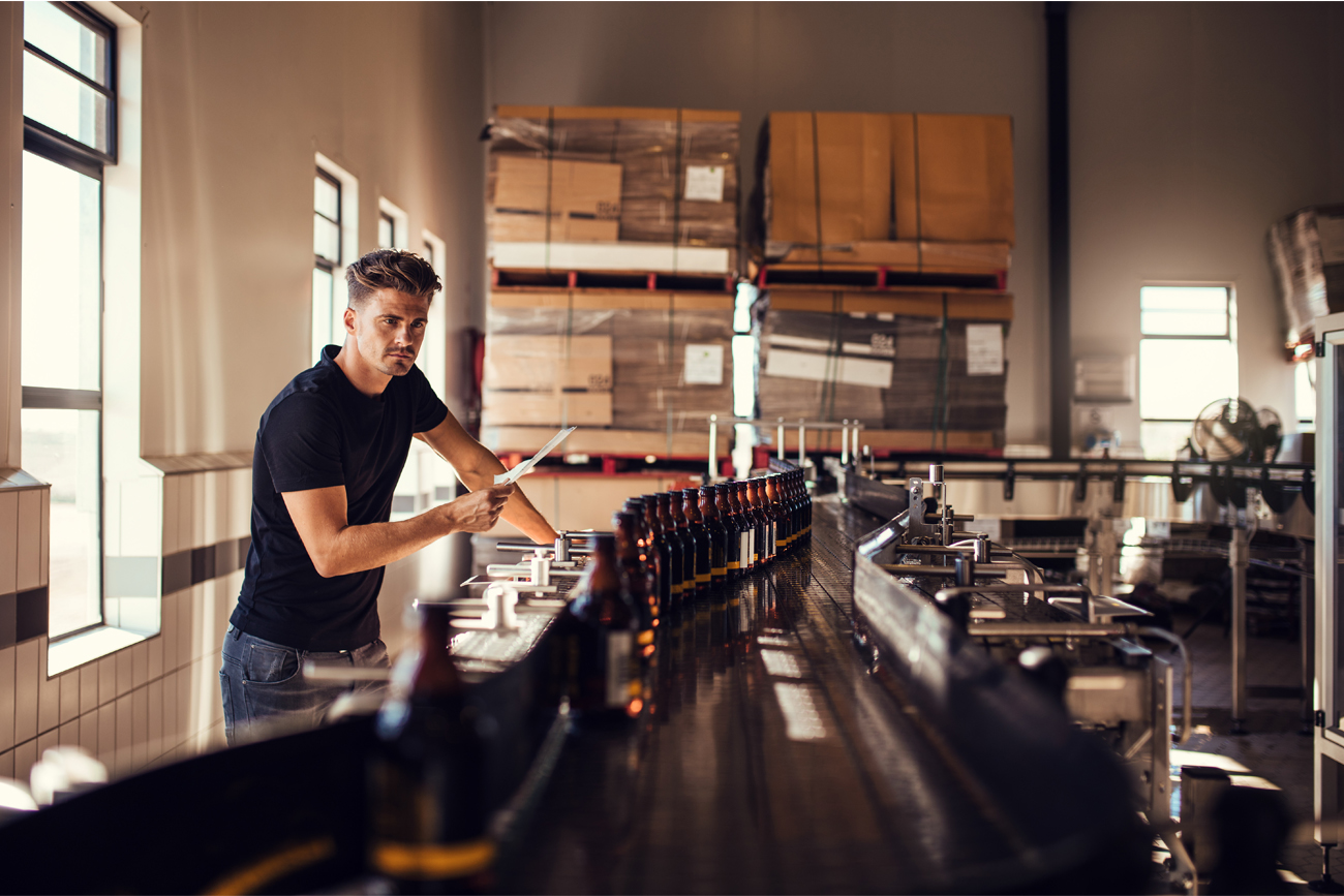 A manufacturing professional is able to review real-time data to make more informed decisions about production.