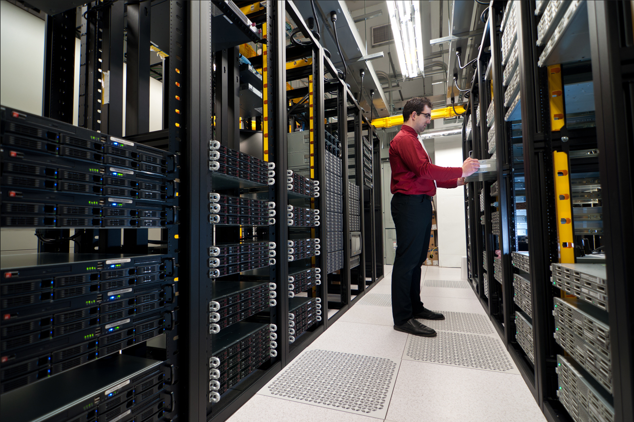 Worker managing business in fracture on premises using IT strategy.