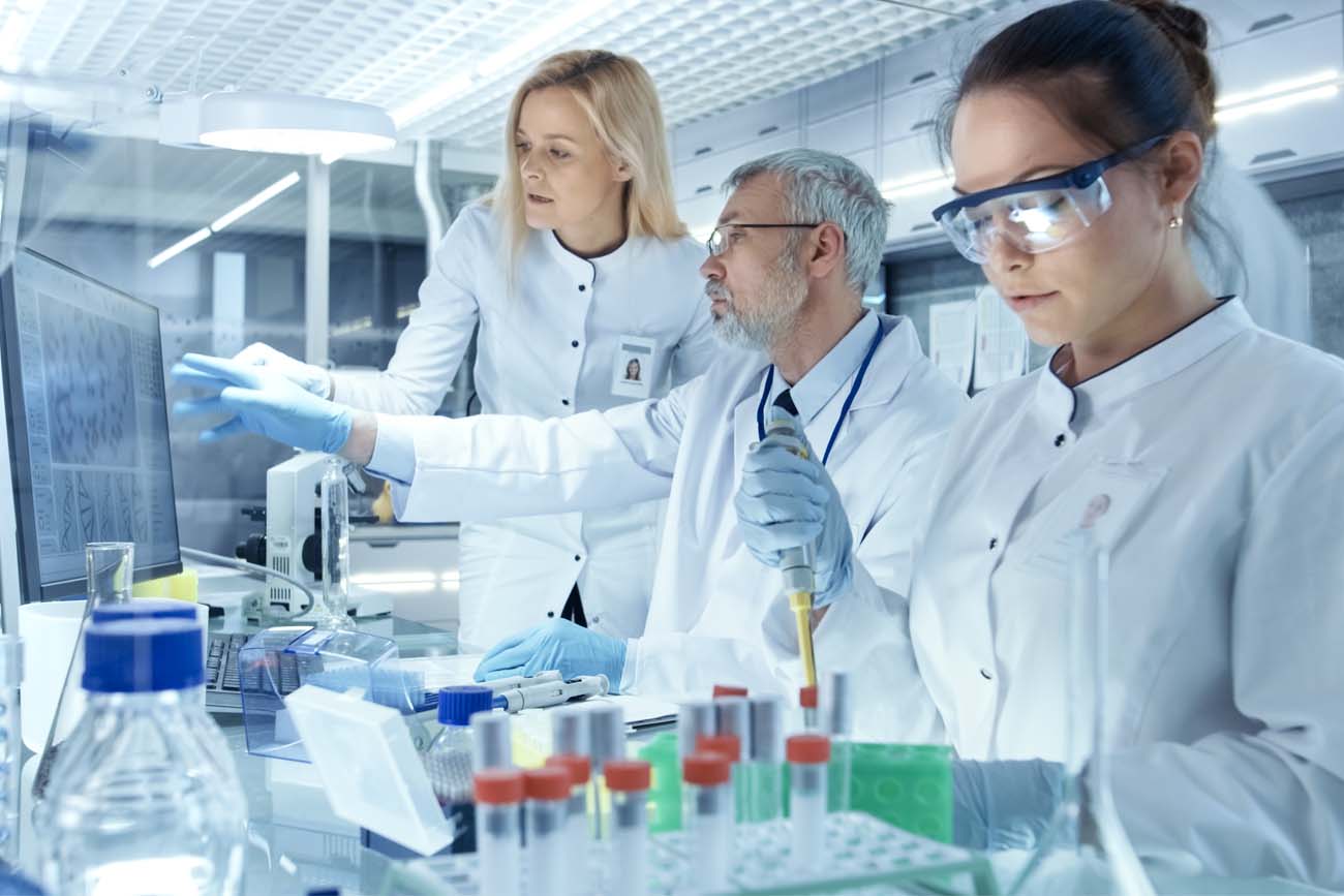 Pharmaceutical staff staying in control of quality.