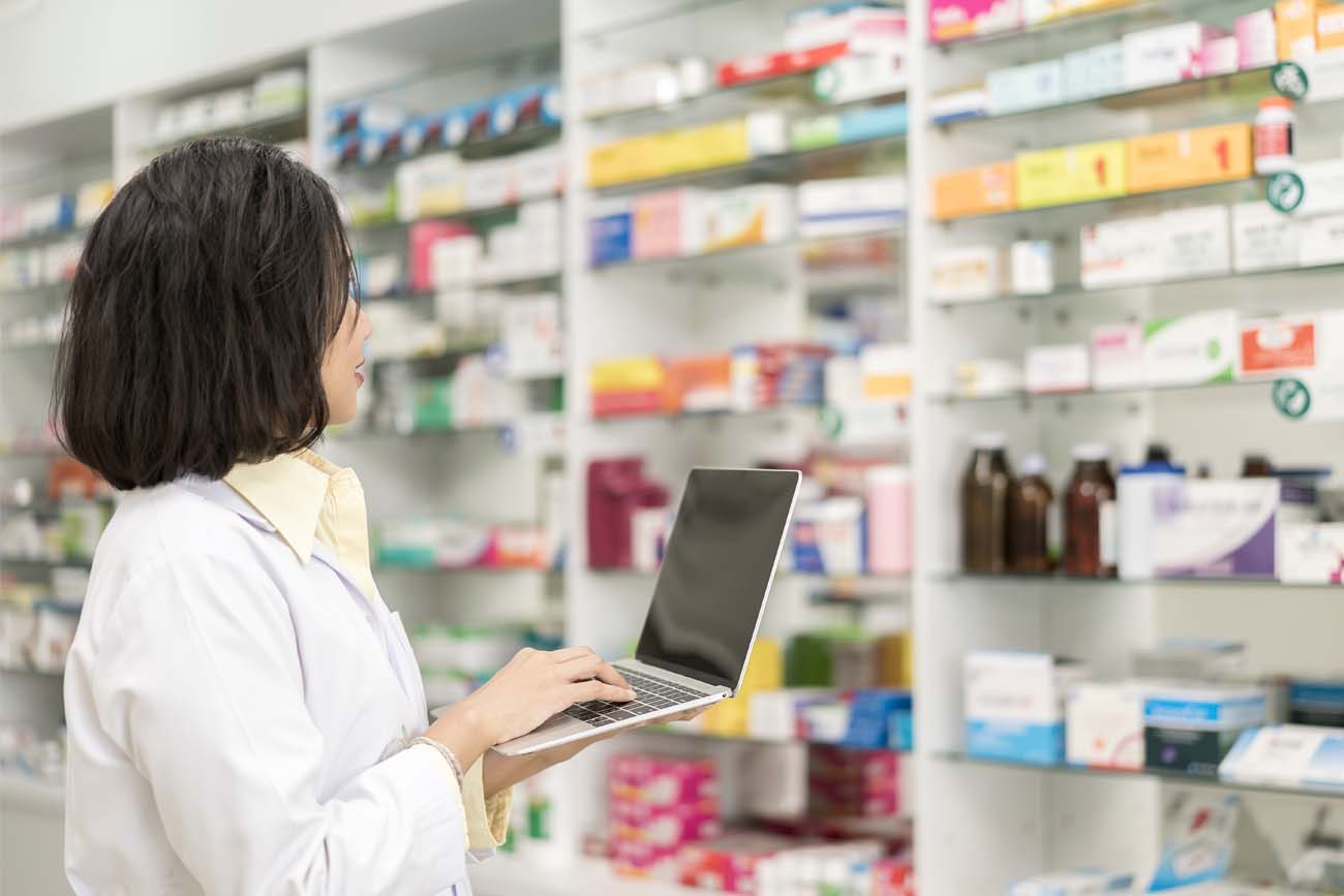Pharmaceutical staff using automated inventory control.