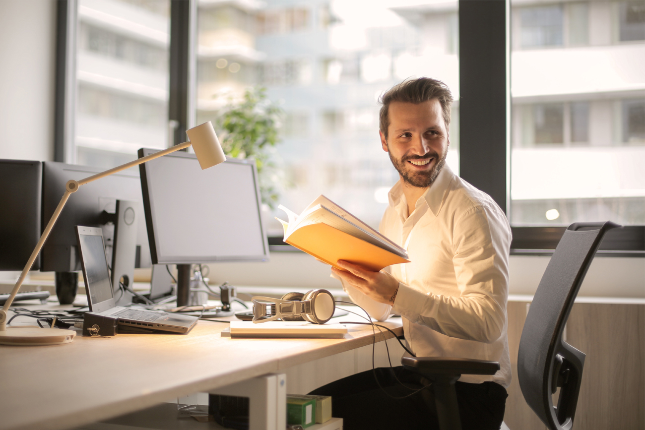 Small business owner managing accounts for end of year financial reporting.